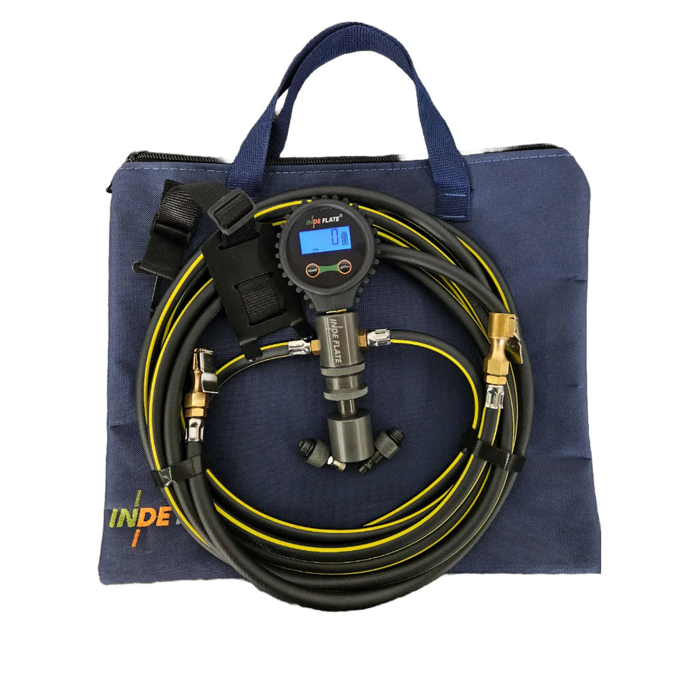 Inflator kit with hose and digital gauge on a blue carrying bag
